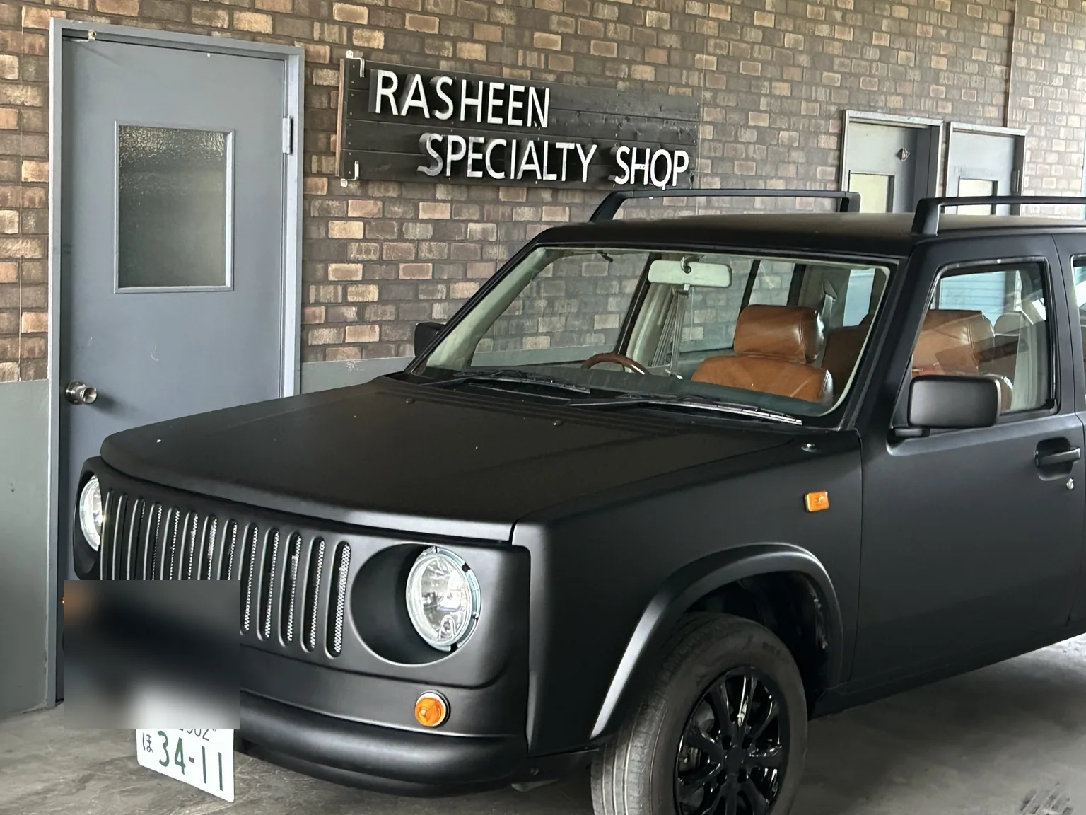 Matte black Nissan Rasheen Adventure Face build