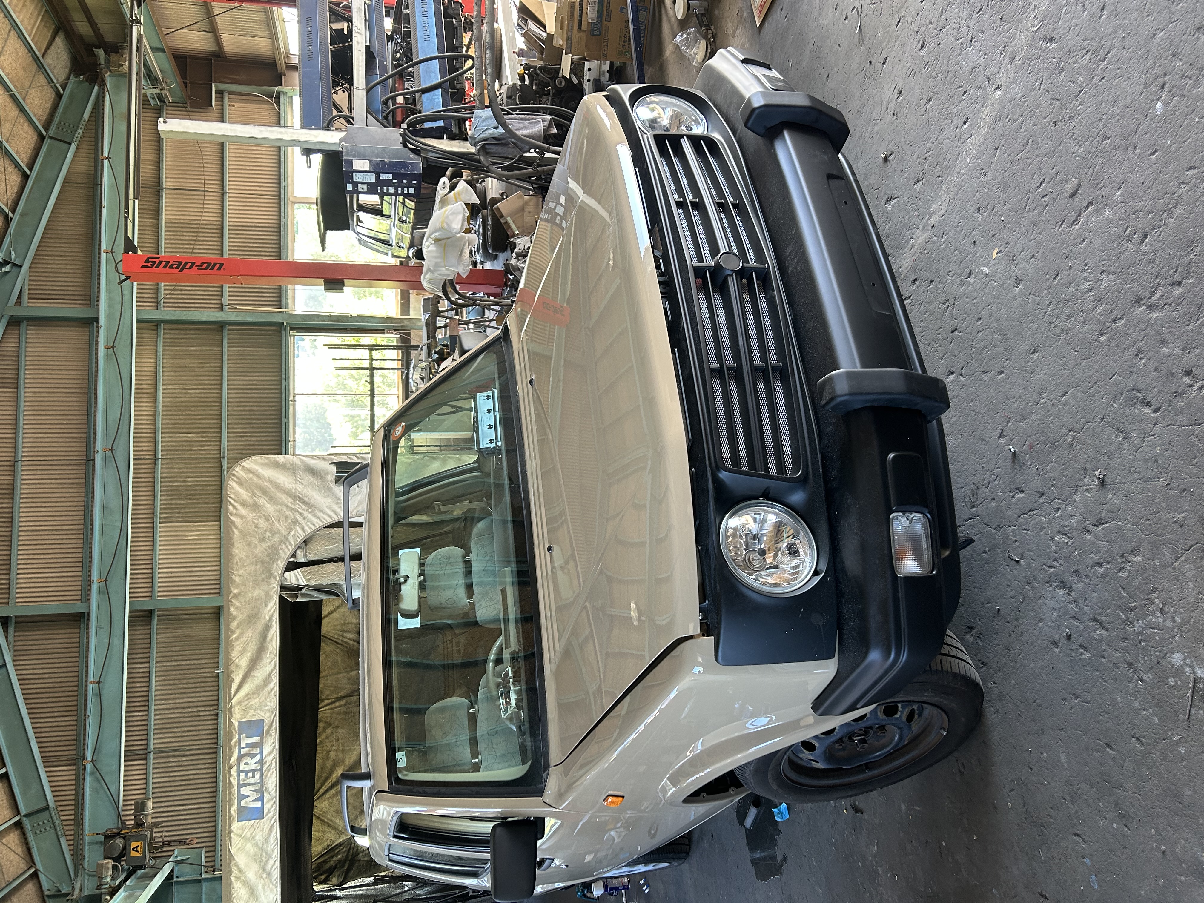 Inside the Workshop: A Beige Nissan Rasheen Takes on a Retro-Inspired New Look