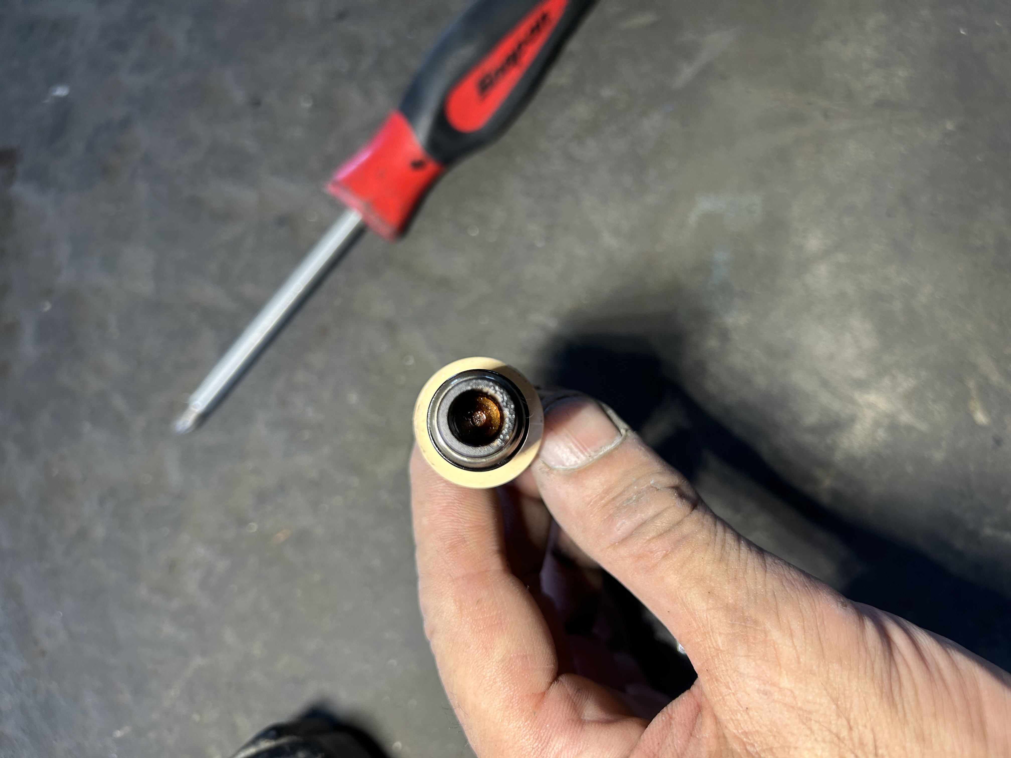 The real culprit—heavy residue built up right at the pintle