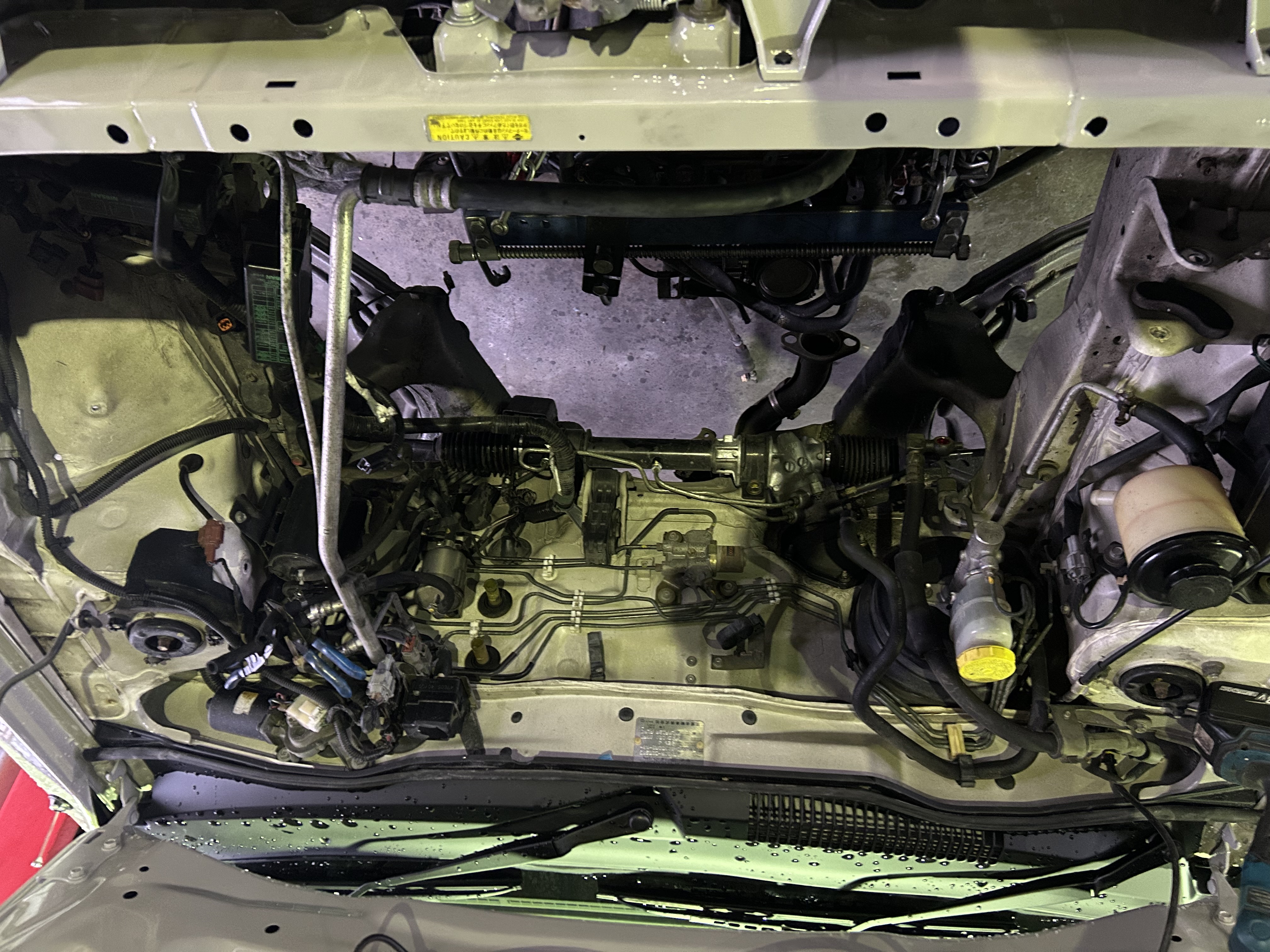 Engine bay after powertrain removal