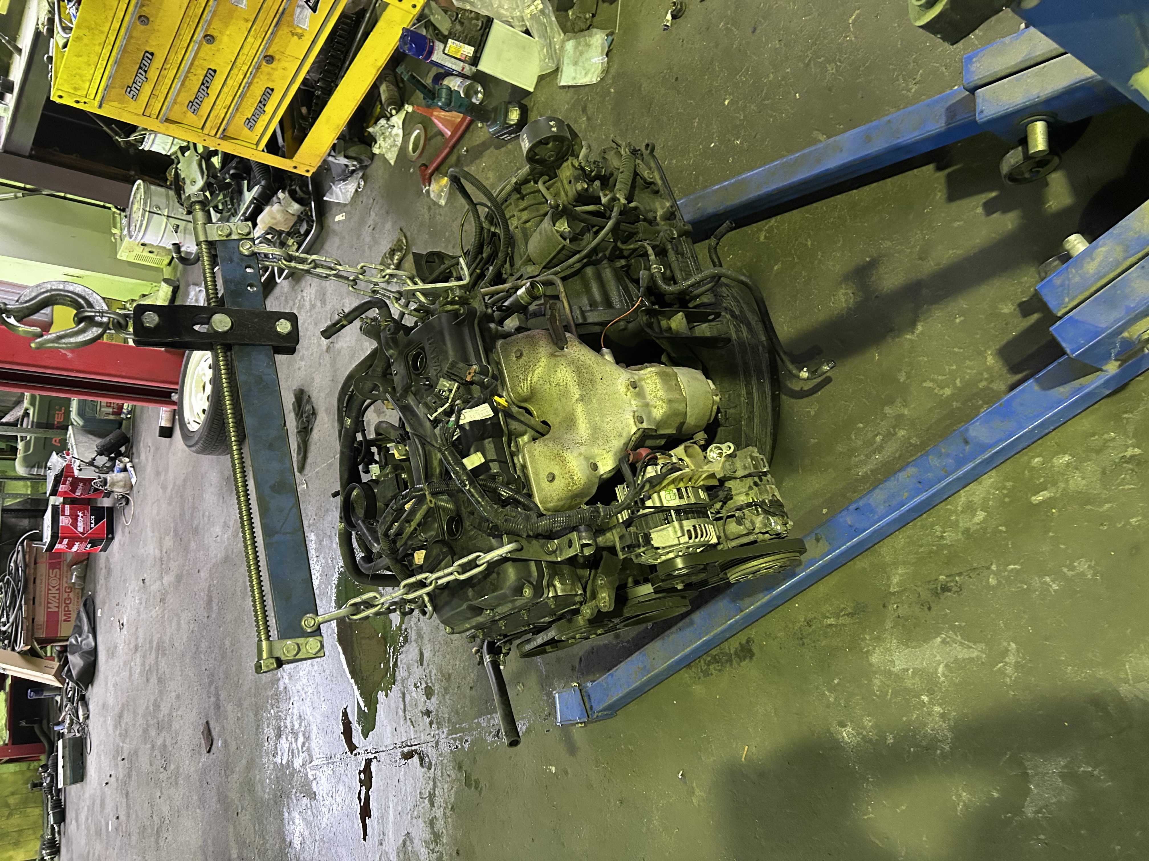 Removed Nissan Rasheen engine and transmission assembly