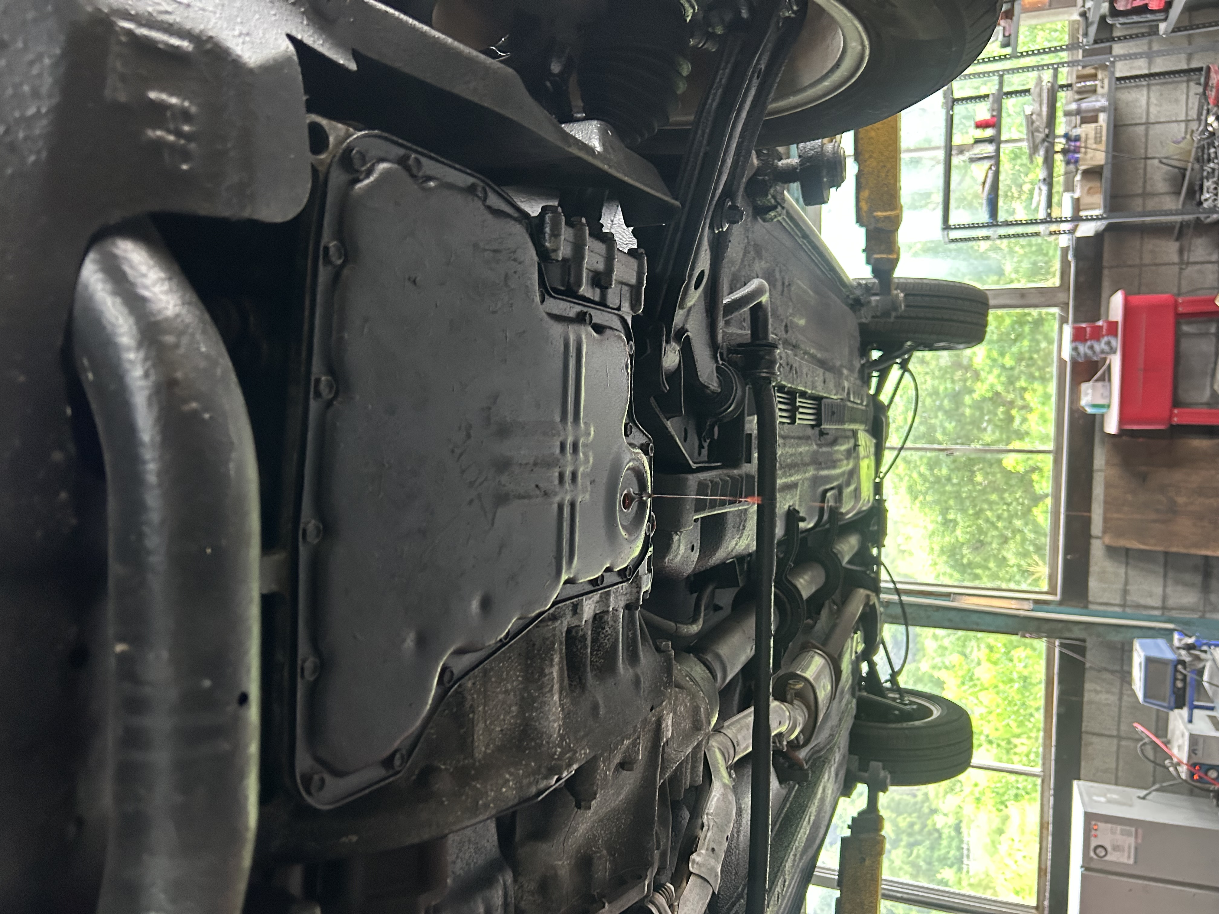 ATF being drained from the transmission oil pan