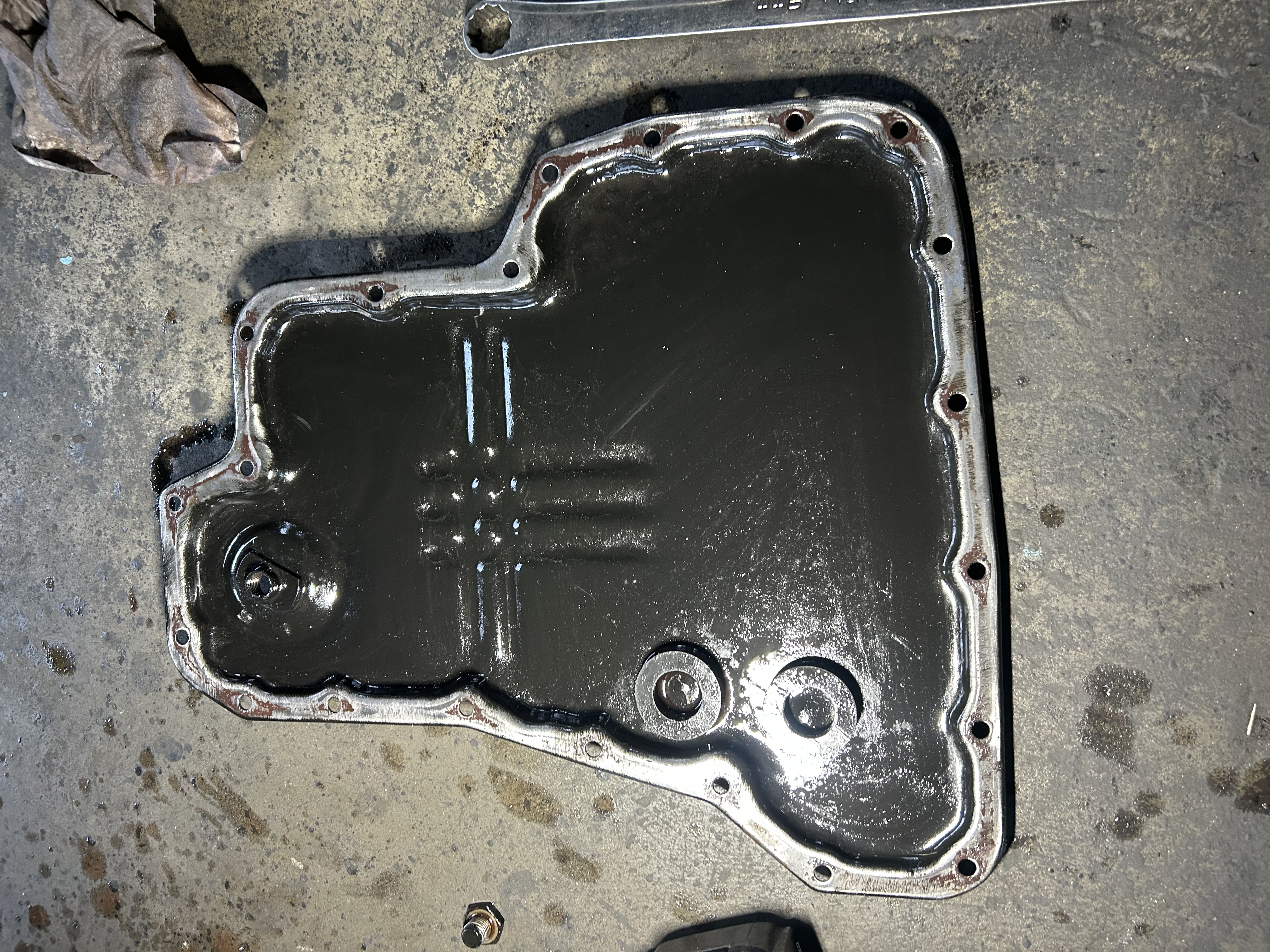 Old gasket material remaining on the oil pan