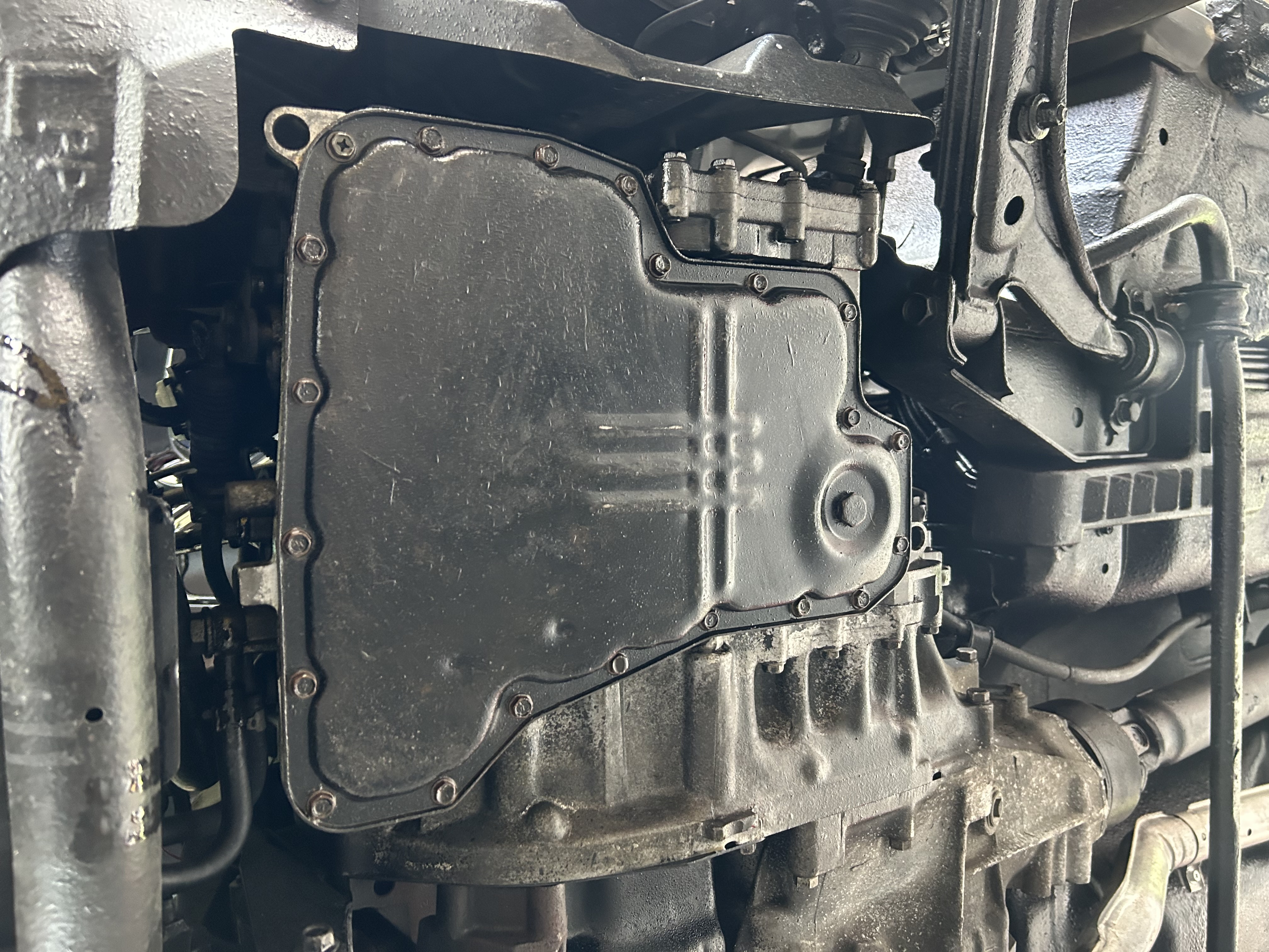 The cleaned oil pan reinstalled