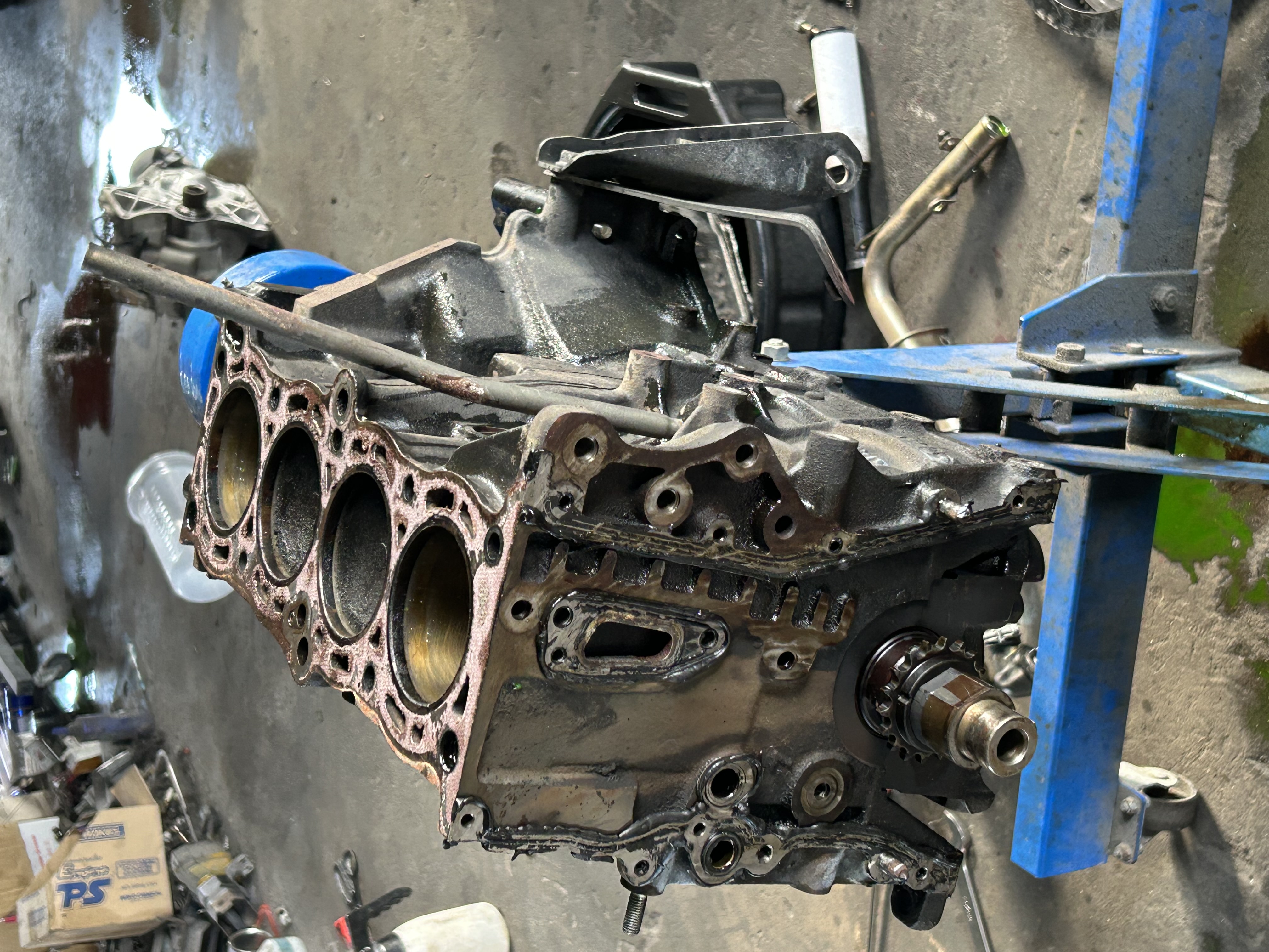 Degreased engine components laid out alongside fresh replacement seals and gaskets.