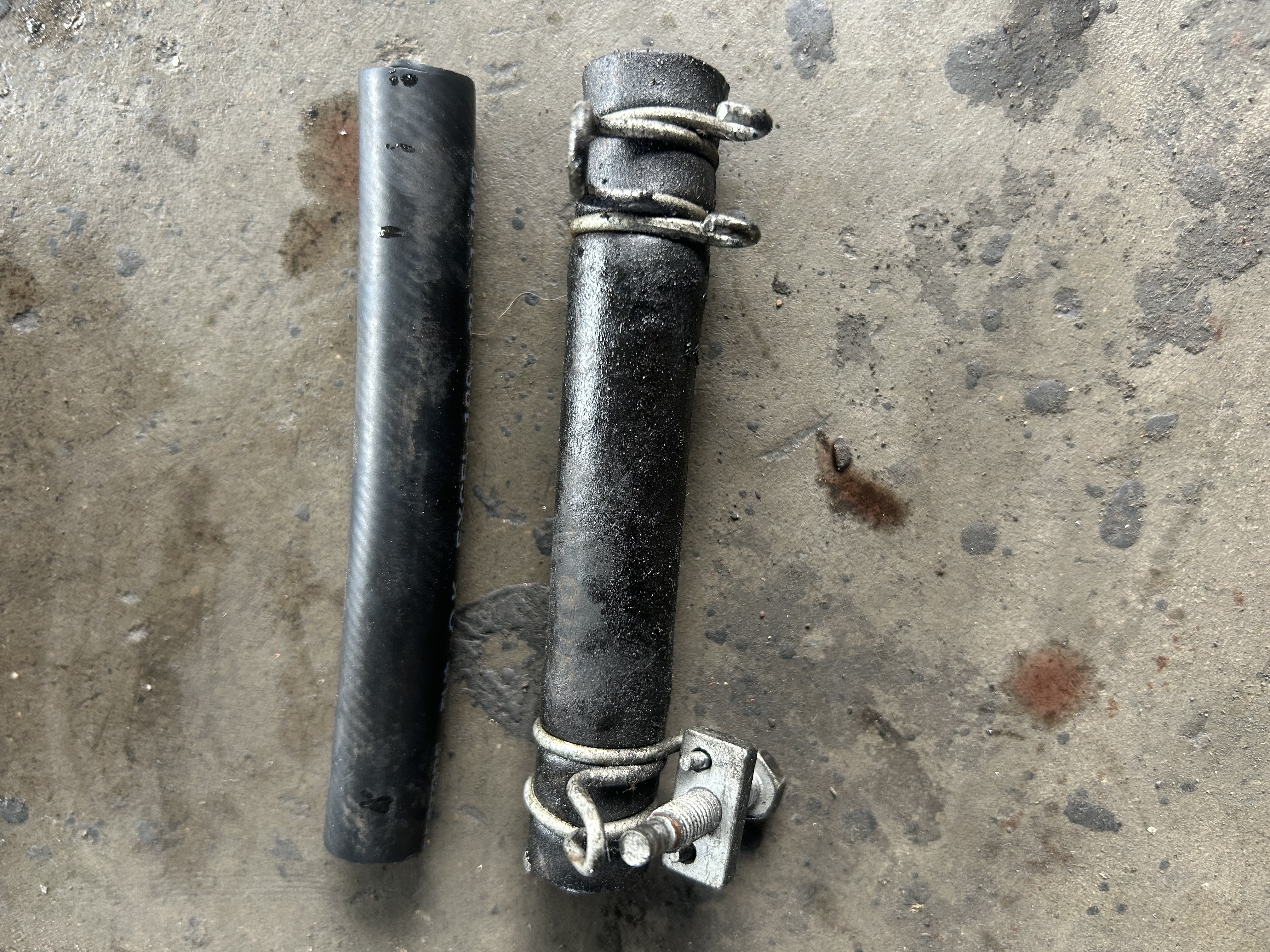 The deteriorated rubber hose and a new hose.