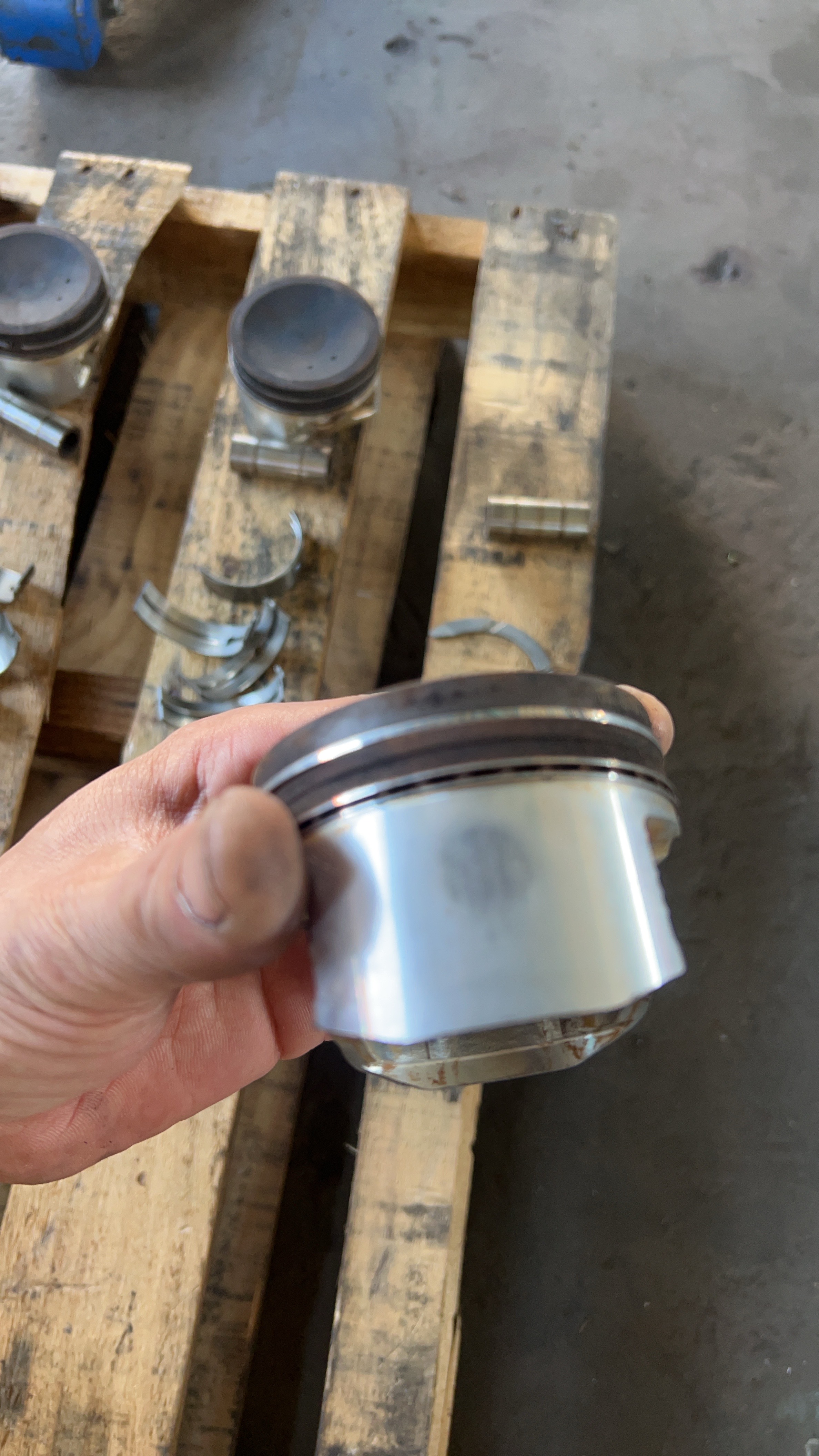 OKAYAMA CUSTOMER PROJECT — Visible wear on a removed piston reveals what exterior photographs cannot.