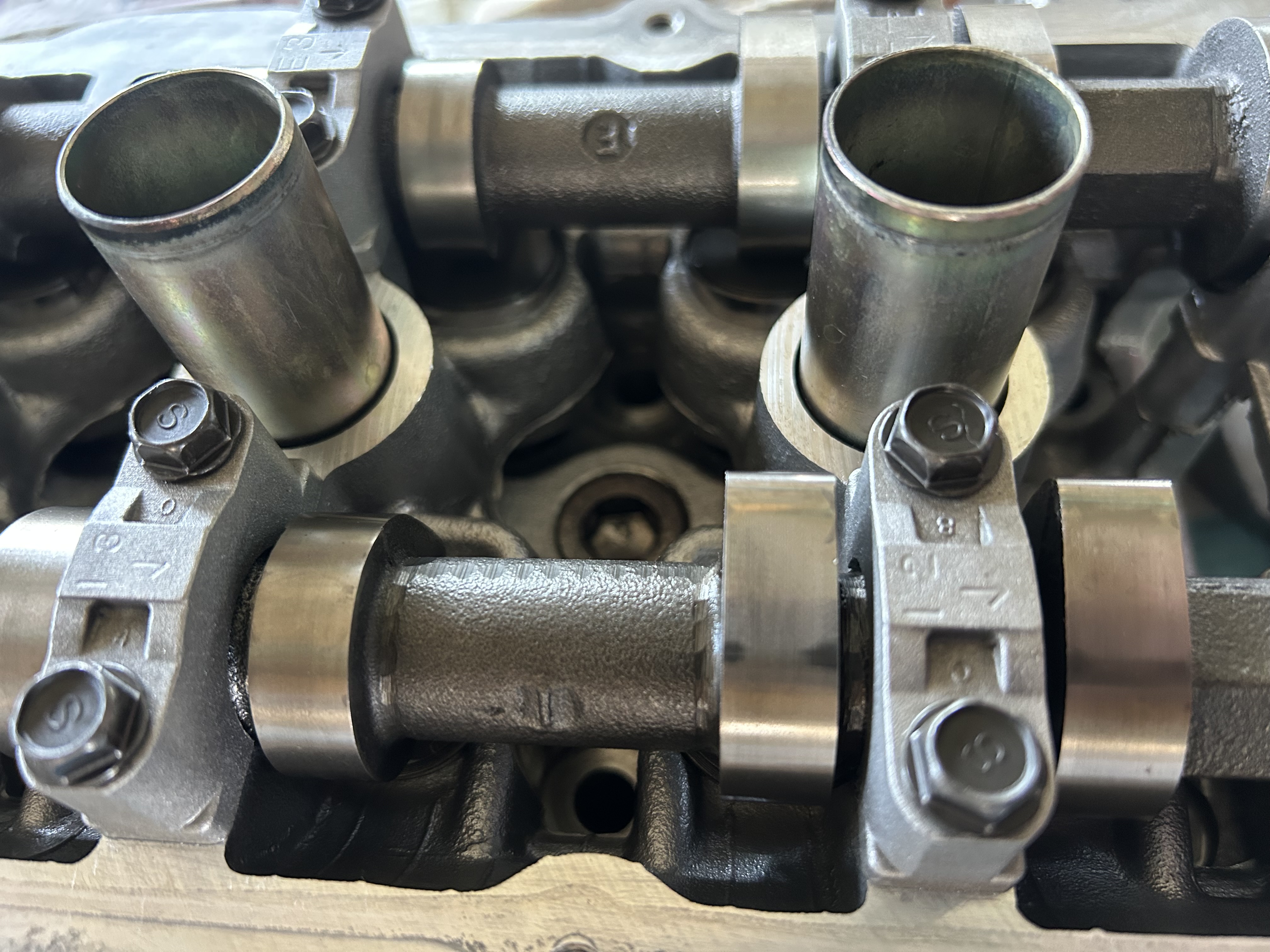 The cleaned and rebuilt cylinder head with the camshafts and caps installed.