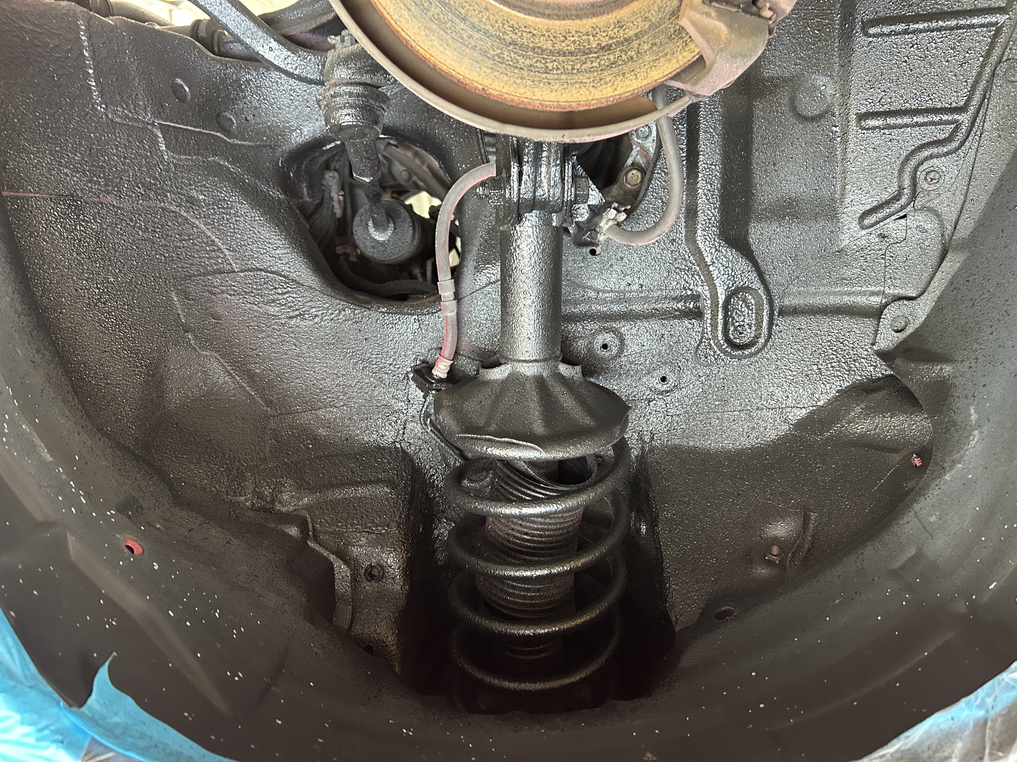 Protective coating inside the front wheel housing
